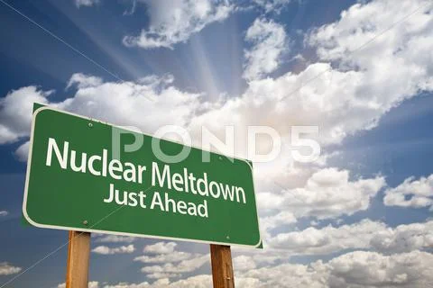 Nuclear Meltdown Green Road Sign with Dramatic Clouds, Sun Rays and Sky. Stock Photos
