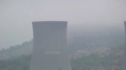 Nuclear power plant hyperboloid cooling tower "chimney" in the fog Stock Footage 49928690
