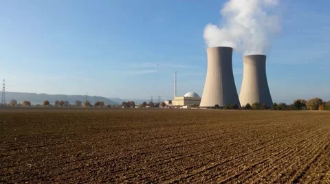 Nuclear power plant on the sky background in sunlight Stockbeeldmateriaal 56987038