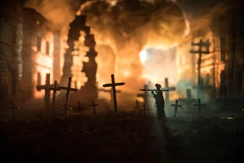 Nuclear war apocalypse concept. Explosion of nuclear bomb in city. Cemetery o Stock Photos