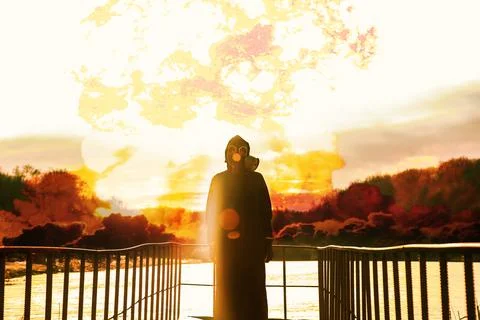 Nuclear war concept. Explosion of nuclear bomb. Silhouette of a person against Stock Photos