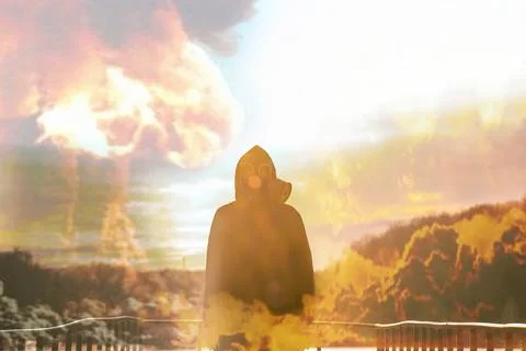 Nuclear war concept. Explosion of nuclear bomb. Silhouette of a person against Photos