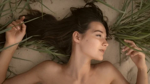 Nude beautiful woman on the nudist beach... | Stock Video