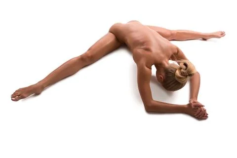 Nude fitness model doing split isolated view Stock Photos