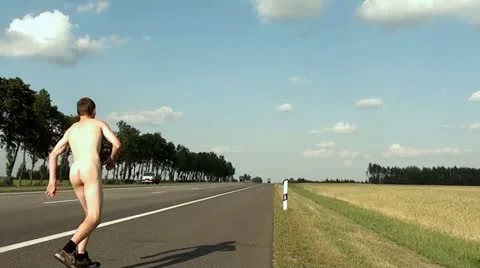A nude man on the road Stock Footage 22022656