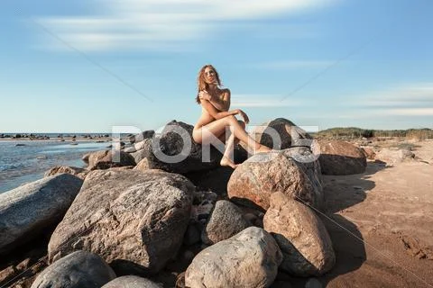 Nude Woman By The Sea