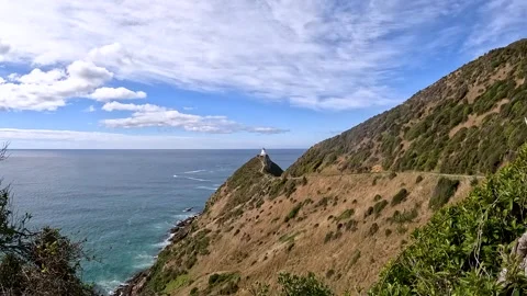 Nugget Point  Iconic Lighthouse and Rugged Coastal Cliffs on the Southern S.. Stock Footage 284778423
