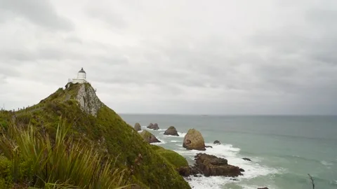 Nugget Point lighthouse on the Catlins coast, Otago, New Zealand. Stock Footage 134656474