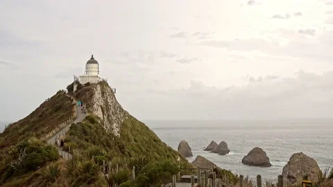 Nugget Point Lighthouse at sunset, New Zealand 스톡 동영상 78595209