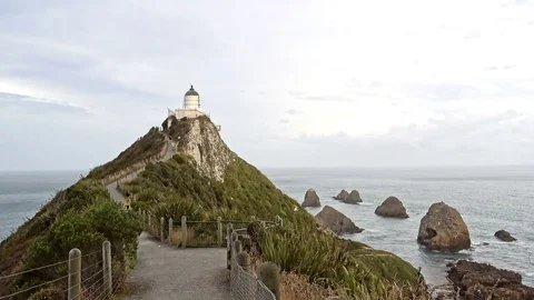 Nugget Point Lighthouse at sunset, New Zealand Stock-Footage 78595237