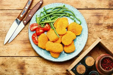 Nuggets with vegetable garnish Stock Photos