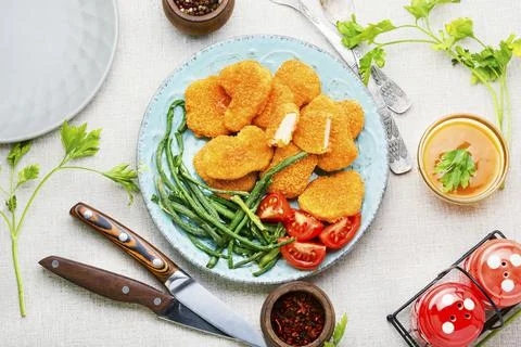 Nuggets with vegetable garnish Stock Photos