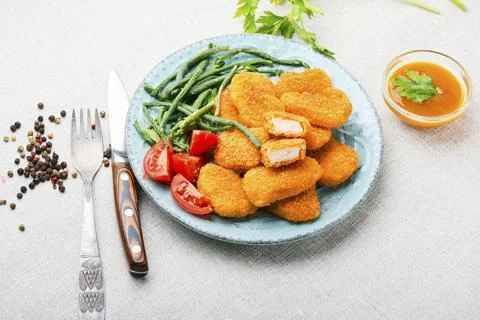 Nuggets with vegetable garnish Stock Photos