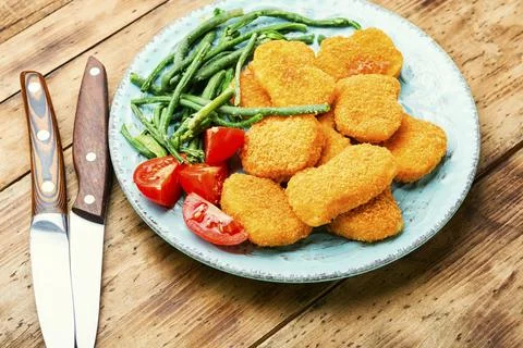 Nuggets with vegetables Stock Photos