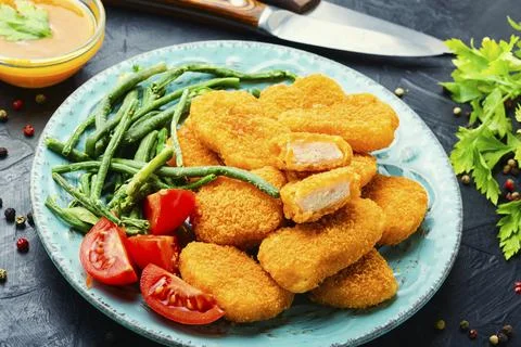 Nuggets with vegetables Stock Photos