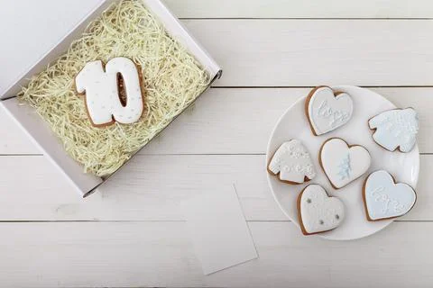 Number 10 shape gingerbread cookie on present box and hearts shapes Stock Photos