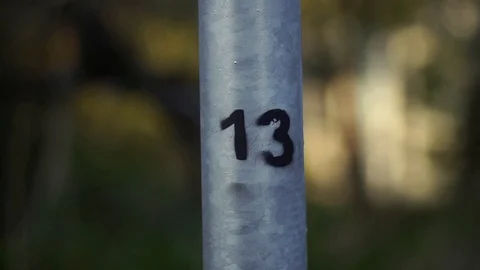 The number 13 is drawn on the pipe in black paint. Stock Footage 100375745