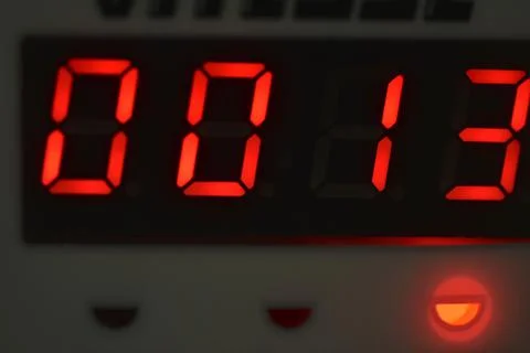 The number 13 on the electronic clock display Foto stock