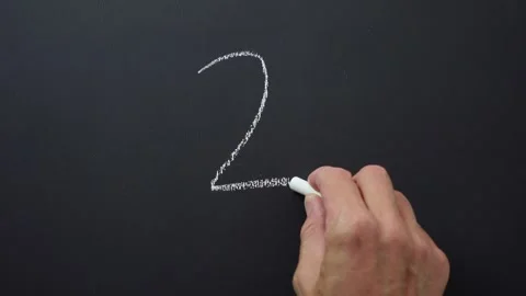 Number 2 handwritten with chalk on black board Stock Footage 285646693