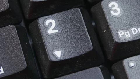 Number 2 key or Down Arrow Key on Desktop Keyboard Pressed by Finger Hand Stock Footage 290474727