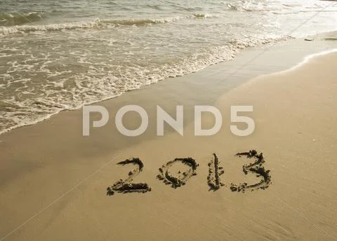 Number 2013 on the beach of sunrise Stock Photos