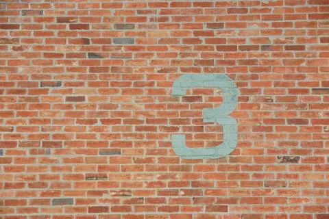 Number 3 painted on old brick wall. Stock Photos