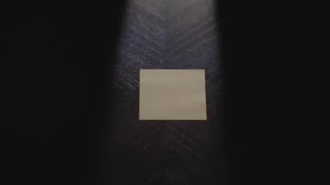 The number 3 written on a post it note and placed by a hand on a table Vidéo 323387110