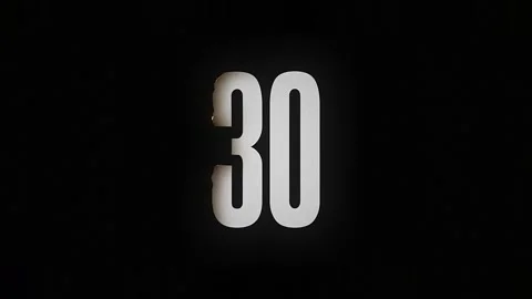 The number 30 burns down and turns into ashes on a black background Stock-Footage 169269564