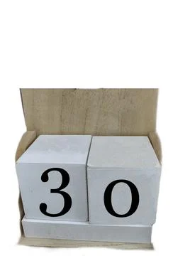 Number 30 on two cubes placed in a wooden support Fotos Stock