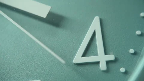 Number 4 on a blue wall clock with moving second hand. The time is four o'clock Stock Footage 295794575