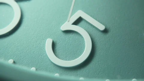 Number 5 on a blue wall clock with moving second hand. The time is five o'clock Stock Footage 295794550