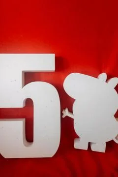 Number 5, letter E. text ONE and peppa pig figure. white foam products. decor Stock Photos