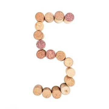 The number 5 is made from wine corks, close-up. Isolated on white background Stock Photos