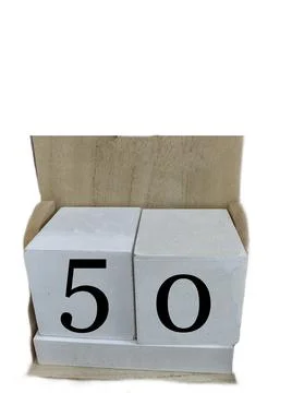 Number 50 on two cubes placed in a wooden support Stock Photos