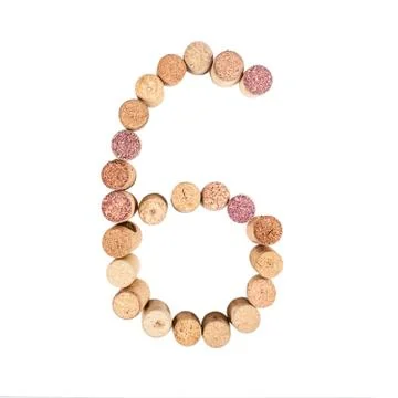 The number 6 is made from wine corks, close-up. Isolated on white background Stock Photos
