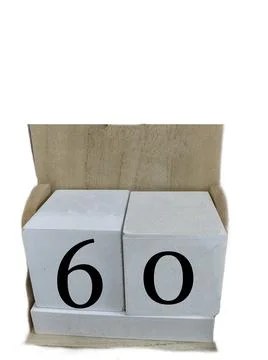 Number 60 on two cubes placed in a wooden support Фото