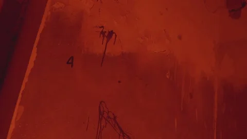 Number 666 is written on a brick wall. Horror abandoned house concept. Red paint Stock Footage 238661681
