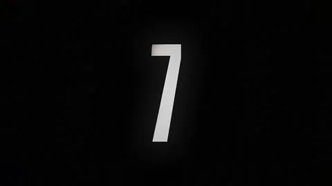 The number 7 burns down and turns into ashes on a black background Video stock 169269837