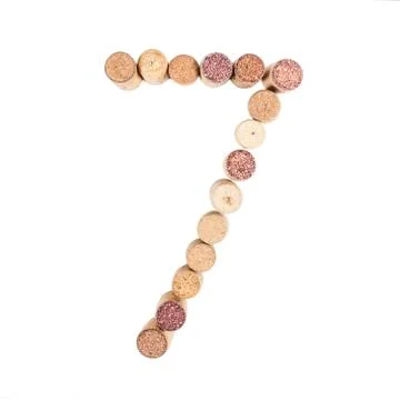 The number 7 is made from wine corks, close-up. Isolated on white background Stock-Fotos