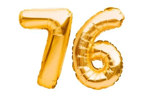 Number 76 seventy six made of golden inflatable balloons isolated on white. H Stock Photos
