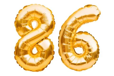 Number 86 eighty six made of golden inflatable balloons isolated on white. He Stock Photos