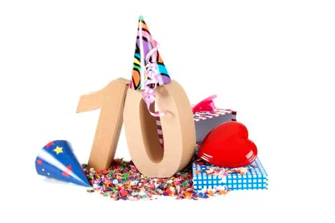 Number of age in a colorful studio setting with paper party hats, a red heart Stock Photos