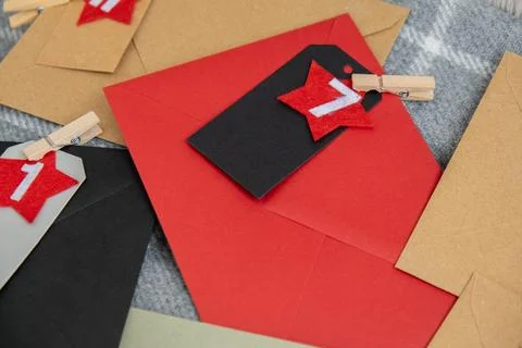 Number on craft envelopes notes with tasks before Christmas holidays. Female Stock Photos