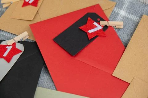 Number on craft envelopes notes with tasks before Christmas holidays. Fema... Stock Photos