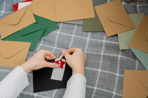 Number on craft envelopes notes with tasks before Christmas holidays. Female Stock Photos