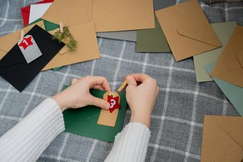 Number on craft envelopes notes with tasks before Christmas holidays. Female Stock Photos