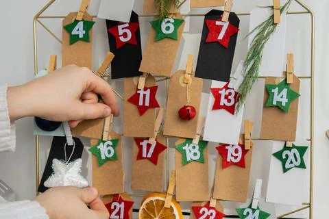 Number on craft paper notes with tasks before Christmas holidays. Female m... Stock Photos