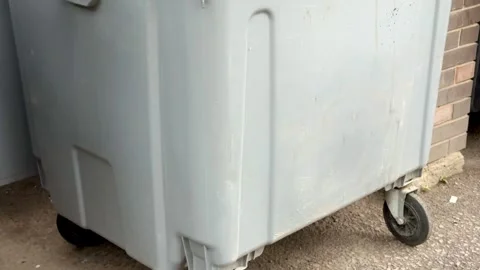 A number of durable containers for urban garbage in a residential neighborhood Stock Footage 316558997