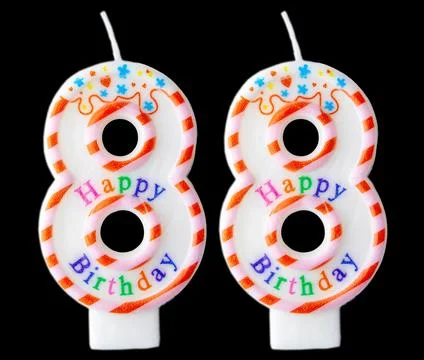 Number eighty eight shaped birthday candle with colorful sprinkles and Happ.. Stock Photos