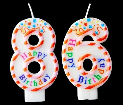 Number eighty six shaped birthday candle with colorful sprinkles and Happy .. Stock Photos